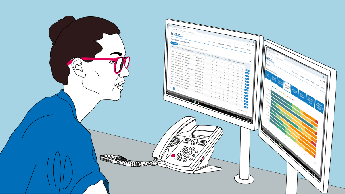The image shows a female administrator sitting in a hospital at a desk with a telephone looking at the two screens in front of her. One screen shows a list of patients, the other shows a list of surgical procedures.